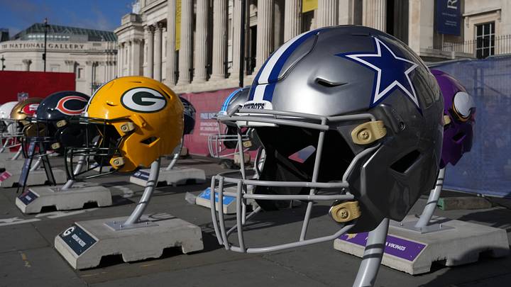 Large helmets of the Dallas Cowboys, Green Bay Packers, Chicago Bears and Arizona Cardinals at the NFL Experience Large helmets of the Dallas Cowboys, Green Bay Packers, Chicago Bears and Arizona Cardinals at the NFL Experience