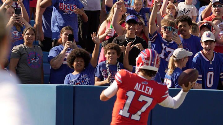 Buffalo Bills quarterback Josh Allen makes his way around the stadium playing catch with children during the Return of the Blue & Red practice at Highmark Stadium in Orchard Park on Aug.1, 2025.