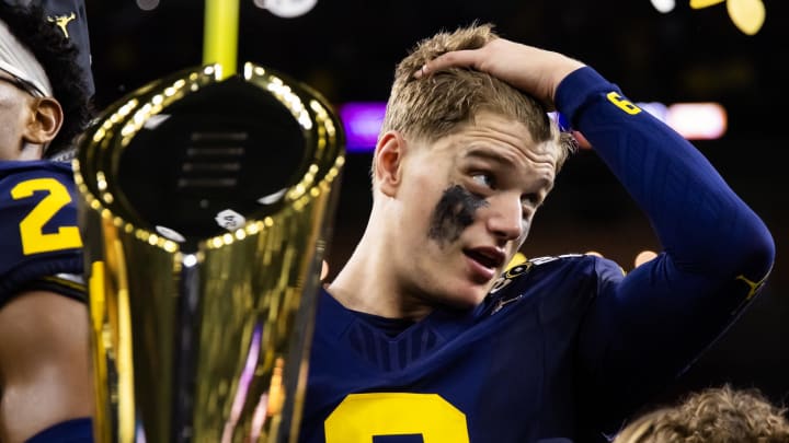 Jan 8, 2024; Houston, TX, USA; Michigan Wolverines quarterback J.J. McCarthy (9) with the National Championship Trophy as he celebrates after winning 2024 College Football Playoff national championship game against the Washington Huskies at NRG Stadium. Mandatory Credit: Mark J. Rebilas-USA TODAY Sports Jan 8, 2024; Houston, TX, USA; Michigan Wolverines quarterback J.J. McCarthy (9) with the National Championship Trophy as he celebrates after winning 2024 College Football Playoff national championship game against the Washington Huskies at NRG Stadium. Mandatory Credit: Mark J. Rebilas-USA TODAY Sports