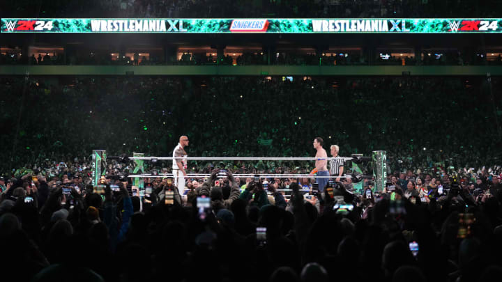 Apr 7, 2024; Philadelphia, PA, USA; The Rock and John Cena interfere during the main event. Apr 7, 2024; Philadelphia, PA, USA; The Rock and John Cena interfere during the main event.