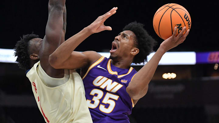 Mar 8, 2026; St. Louis, MO, USA;  Northern Iowa Panthers guard Leon Bond III (35) shoots the ball over UIC Flames forward Abdul Momoh (7) during the second half at Enterprise Center.
