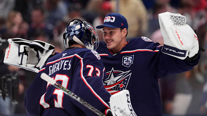 Elvis Merzlikins congratulates Jet Greaves after a win over the Tampa Bay Lightning. Elvis Merzlikins congratulates Jet Greaves after a win over the Tampa Bay Lightning.