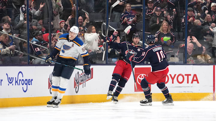 Adam Fantilli celebrates a goal with Dmitri Voronkov. 