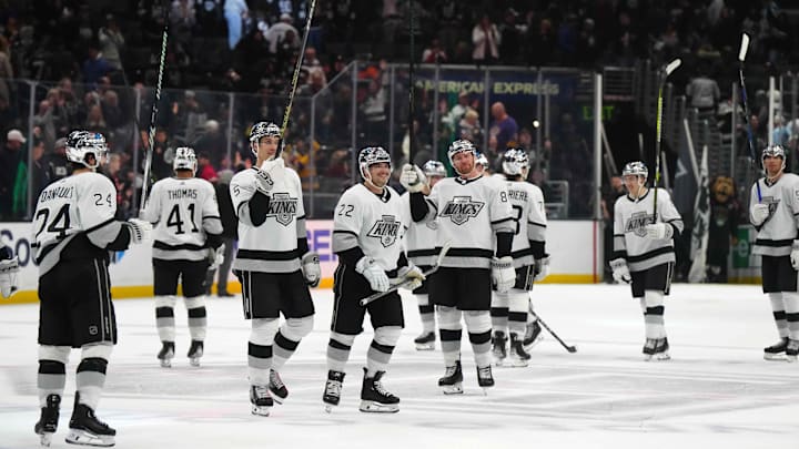 Apr 13, 2024; Los Angeles, California, USA; LA Kings center Phillip Danault (24), defenseman Andreas Englund (5), left wing Kevin Fiala (22) and defenseman Vladislav Gavrikov (84) celebrate after the game against the Anaheim Ducks at Crypto.com Arena. Mandatory Credit: Kirby Lee-Imagn Images