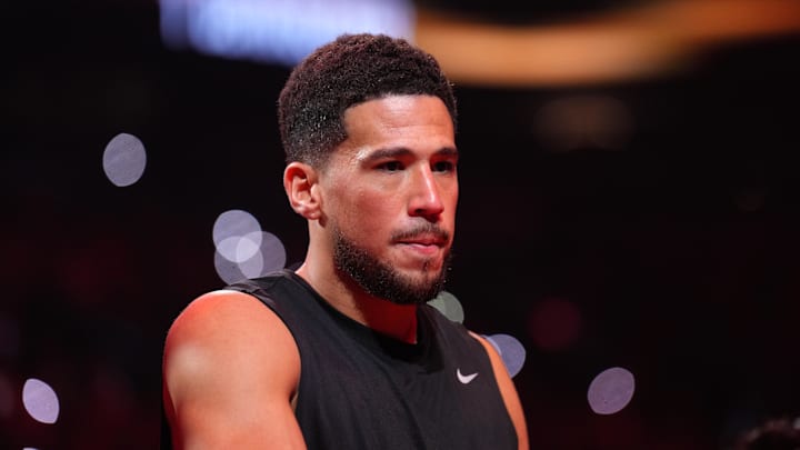 Mar 8, 2026; Phoenix, Arizona, USA; Phoenix Suns guard Devin Booker (1) is introduced against the Charlotte Hornets before the first half at Mortgage Matchup Center. Mandatory Credit: Joe Camporeale-Imagn Images