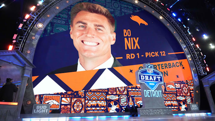 Apr 25, 2024; Detroit, MI, USA; Oregon Ducks quarterback Box Nix is selected as the NO. 12 pick in the first round by the Denver Broncos during the 2024 NFL Draft at Campus Martius Park and Hart Plaza. Mandatory Credit: Kirby Lee-Imagn Images Apr 25, 2024; Detroit, MI, USA; Oregon Ducks quarterback Box Nix is selected as the NO. 12 pick in the first round by the Denver Broncos during the 2024 NFL Draft at Campus Martius Park and Hart Plaza. Mandatory Credit: Kirby Lee-Imagn Images