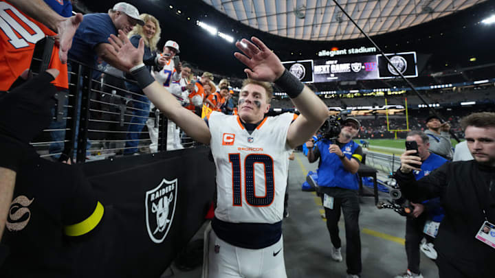 Dec 7, 2025; Paradise, Nevada, USA; Denver Broncos quarterback Bo Nix (10) high five fans following a game against the Las Vegas Raiders  at Allegiant Stadium. Mandatory Credit: Kirby Lee-Imagn Images
