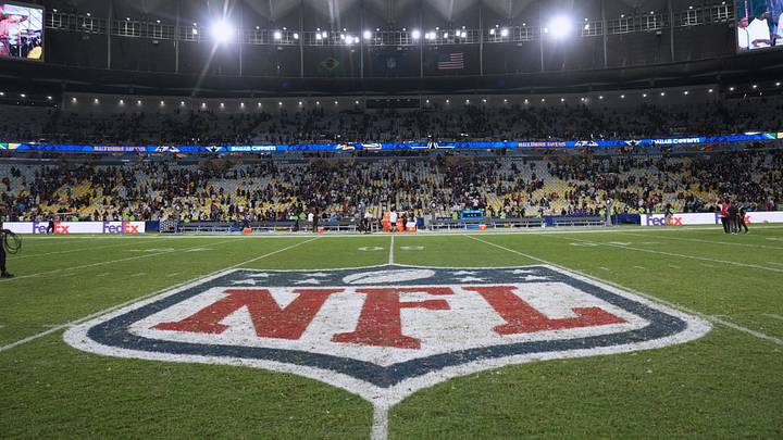 Sep 27, 2026; Rio De Janeiro, BRA; A view of the NFL shield logo at midfield after the game between Baltimore Ravens and Dallas Cowboys at Maracana Stadium. Mandatory Credit: Kirby Lee-Imagn Images Sep 27, 2026; Rio De Janeiro, BRA; A view of the NFL shield logo at midfield after the game between Baltimore Ravens and Dallas Cowboys at Maracana Stadium. Mandatory Credit: Kirby Lee-Imagn Images