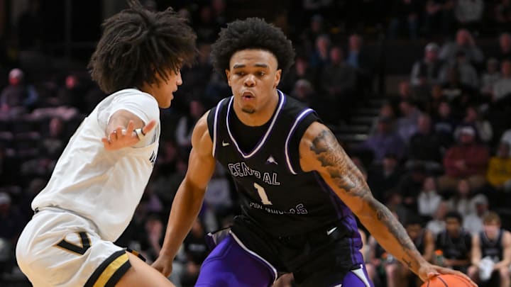 Dec 13, 2025; Nashville, Tennessee, USA;  Central Arkansas Bears guard Camren Hunter (1) dribbles the ball past Vanderbilt Commodores guard Tyler Tanner (3) during the second half at Memorial Gymnasium. Mandatory Credit: Steve Roberts-Imagn Images