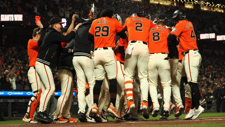 Jun 28, 2024; San Francisco, California, USA; San Francisco Giants players surround second baseman Brett Wisely (0) after Wisely hit a two-run home run for a walk-off win against the Los Angeles Dodgers during the ninth inning at Oracle Park. Mandatory Credit: Kelley L Cox-USA TODAY Sports Jun 28, 2024; San Francisco, California, USA; San Francisco Giants players surround second baseman Brett Wisely (0) after Wisely hit a two-run home run for a walk-off win against the Los Angeles Dodgers during the ninth inning at Oracle Park. Mandatory Credit: Kelley L Cox-USA TODAY Sports