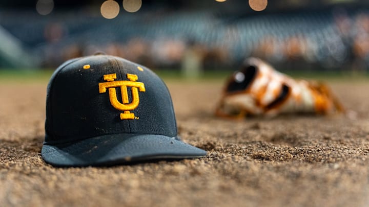 Jun 24, 2024; Omaha, NE, USA; A Tennessee Volunteers hat and glove lay on the field after defeating the Texas A&M Aggies in the championship at Charles Schwab Field Omaha. Mandatory Credit: Dylan Widger-Imagn Images Jun 24, 2024; Omaha, NE, USA; A Tennessee Volunteers hat and glove lay on the field after defeating the Texas A&M Aggies in the championship at Charles Schwab Field Omaha. Mandatory Credit: Dylan Widger-Imagn Images