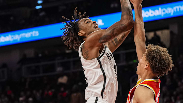 Feb 22, 2026; Atlanta, Georgia, USA; Brooklyn Nets center Nic Claxton (33) shoots over Atlanta Hawks guard Dyson Daniels (5) during the first half at State Farm Arena. Mandatory Credit: Dale Zanine-Imagn Images Feb 22, 2026; Atlanta, Georgia, USA; Brooklyn Nets center Nic Claxton (33) shoots over Atlanta Hawks guard Dyson Daniels (5) during the first half at State Farm Arena. Mandatory Credit: Dale Zanine-Imagn Images