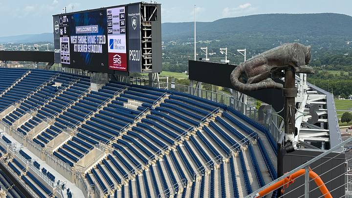 A view of the Nittany Lion weathervane and scoreboard from the new bleachers on the west side of Penn State's Beaver Stadium. A view of the Nittany Lion weathervane and scoreboard from the new bleachers on the west side of Penn State's Beaver Stadium.
