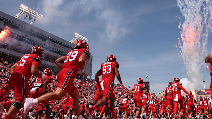 The Utah Utes run out on the field before the game against the Baylor Bears at Rice-Eccles Stadium. 