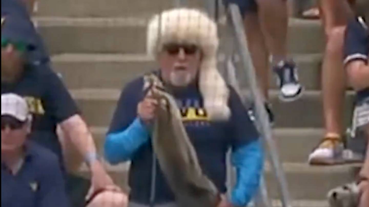 Lightning McQueen and a Guy with a Raccoon Showed Up to WVU'