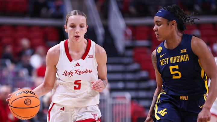 Texas Tech's Denae Fritz dribbles against West Virginia's Sydney Shaw during a Big 12 Conference women's basketball game, Wednesday, Jan. 8, 2025, in United Supermarkets Arena.