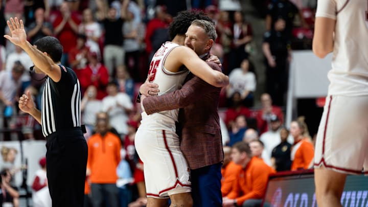 Alabama guard Houston Mallette hugs head coach Nate Oats after exiting the game in the second half of the game against Auburn on Mar. 7, 2026. 