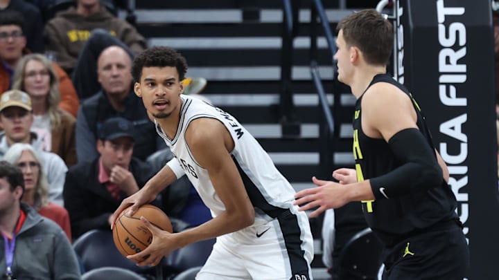 Oct 31, 2024; Salt Lake City, Utah, USA; San Antonio Spurs center Victor Wembanyama (1) controls the ball against Utah Jazz center Walker Kessler (24) during the first quarter at Delta Center. Mandatory Credit: Rob Gray-Imagn Images