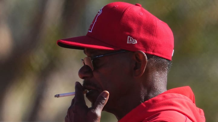 Angels manager Ron Washington smokes a cigarette during a Spring Training workout at Tempe Diablo Stadium on Feb. 16, 2024.