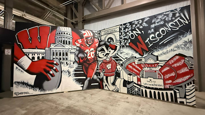 The Wisconsin football program commissioned local artist Tony Catteruccia to create a mural that will be used for official visits.