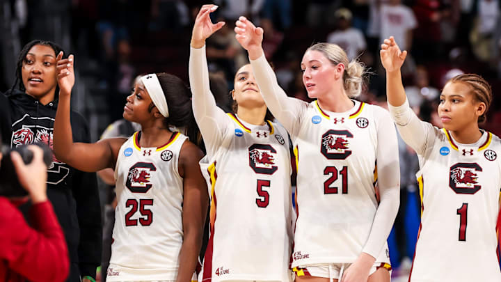 Mar 23, 2025; Columbia, South Carolina, USA;  South Carolina Gamecocks forward Ashlyn Watkins (2), guard Raven Johnson (25), guard Tessa Johnson (5), forward Chloe Kitts (21) and guard Maddy McDaniel (1) celebrate following their win against the Indiana Hoosiers at Colonial Life Arena. Mandatory Credit: Jeff Blake-Imagn Images