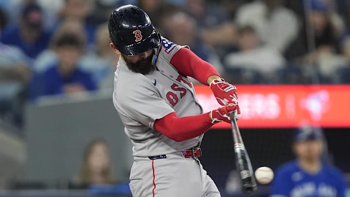 Sep 25, 2025; Toronto, Ontario, CAN; Boston Red Sox catcher Connor Wong (12) makes contact with the ball against the Toronto Blue Jays during the sixth inning at Rogers Centre. Mandatory Credit: John E. Sokolowski-Imagn Images