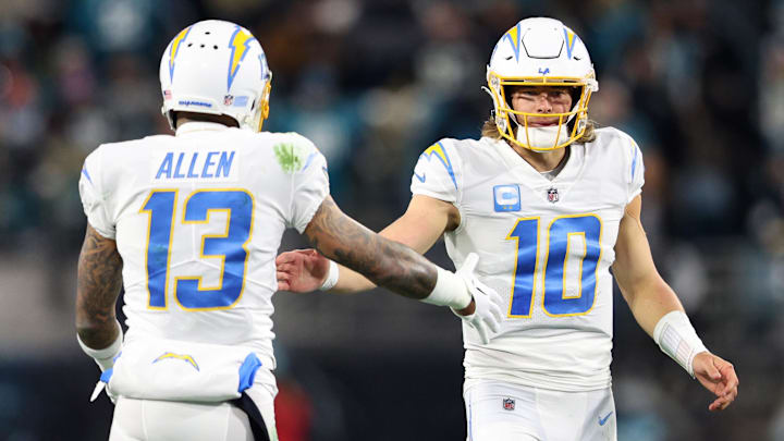 Los Angeles Chargers quarterback Justin Herbert and wide receiver Keenan Allen celebrate after a play.