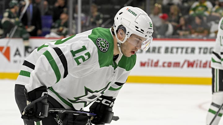 Sep 29, 2024; Saint Paul, Minnesota, USA;  Dallas Stars forward Arttu Hyry (12) lines up for a face-off against the Minnesota Wild during the first period at Xcel Energy Center. Mandatory Credit: Nick Wosika-Imagn Images