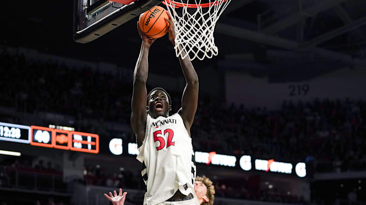 Cincinnati Bearcats center Moustapha Thiam (52) hits a layup in the second half of a NCAA men’s basketball game between the Cincinnati Bearcats and Oklahoma State Cowboys, Saturday, Feb. 28, 2026, at Fifth Third Arena in Cincinnati. Bearcats won 91-68.