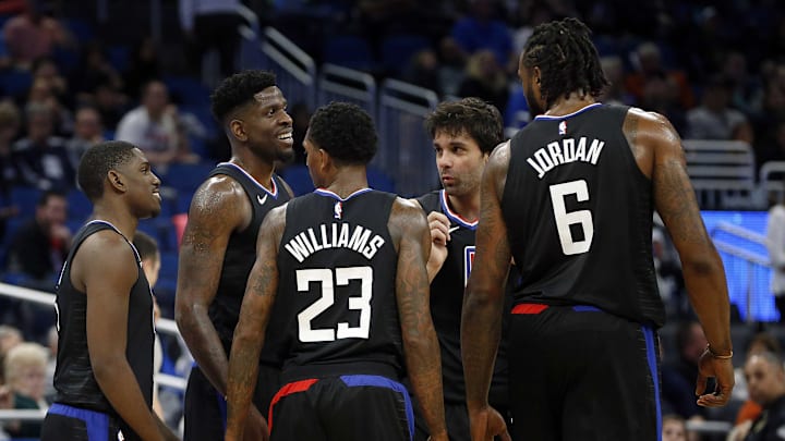 Dec 13, 2017; Orlando, FL, USA; LA Clippers center DeAndre Jordan (6), guard Milos Teodosic (4), guard Lou Williams (23),  forward Jamil Wilson (13) and guard Jawun Evans (1) huddle up against the Orlando Magic during the second quarter at Amway Center. Mandatory Credit: Kim Klement-Imagn Images