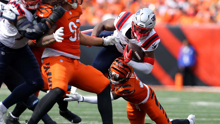 Sep 8, 2024; Cincinnati, Ohio, USA; New England Patriots running back Antonio Gibson (4) runs the ball as Cincinnati Bengals cornerback Mike Hilton (21) makes the tackle during the third quarter at Paycor Stadium. Mandatory Credit: Joseph Maiorana-Imagn Images Sep 8, 2024; Cincinnati, Ohio, USA; New England Patriots running back Antonio Gibson (4) runs the ball as Cincinnati Bengals cornerback Mike Hilton (21) makes the tackle during the third quarter at Paycor Stadium. Mandatory Credit: Joseph Maiorana-Imagn Images
