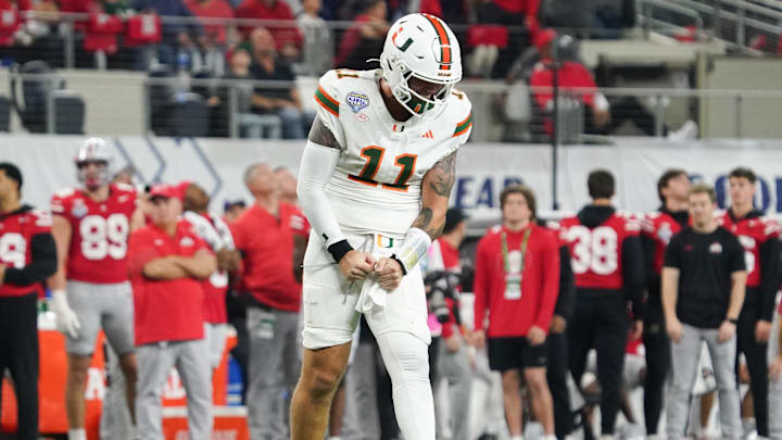 Dec 31, 2025; Arlington, TX, USA; Miami Hurricanes quarterback Carson Beck (11) reacts after a successful pass in the fourth quarter against the Ohio State Buckeyes during the 2025 Cotton Bowl and quarterfinal game of the College Football Playoff at AT&T Stadium. Mandatory Credit: Raymond Carlin III-Imagn Images