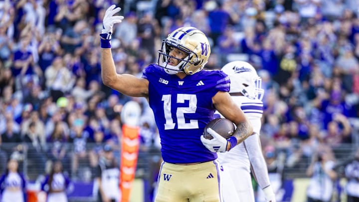 Washington Huskies wide receiver Denzel Boston (12) celebrates after catching a touchdown pass against the Northwestern Wildcats during the second quarter at Alaska Airlines Field at Husky Stadium.