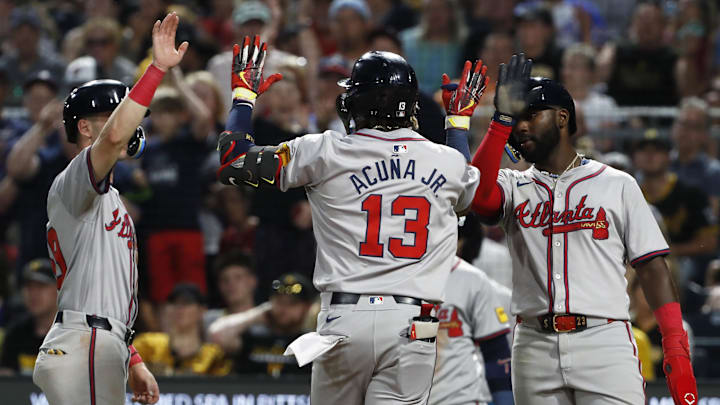 Atlanta Braves third baseman Zack Short (left) and Atlanta center fielder Michael Harris II (right) congratulate right fielder Ronald Acuna Jr. Atlanta Braves third baseman Zack Short (left) and Atlanta center fielder Michael Harris II (right) congratulate right fielder Ronald Acuna Jr.