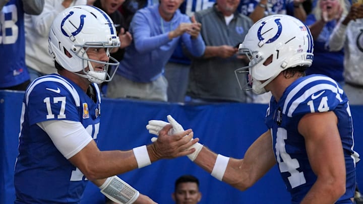 Indianapolis Colts quarterback Daniel Jones (17) celebrates with wide receiver Alec Pierce (14) after Jones scores a touchdown during a game against the Arizona Cardinals on Sunday, Oct. 12, 2025, at Lucas Oil Stadium in Indianapolis