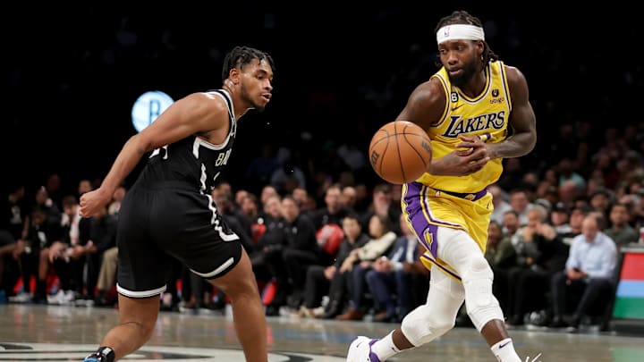 Jan 30, 2023; Brooklyn, New York, USA: Brooklyn Nets guard Cam Thomas (24) knocks the ball away from Los Angeles Lakers guard Patrick Beverley (21) during the fourth quarter at Barclays Center. Mandatory Credit: Brad Penner-Imagn Images