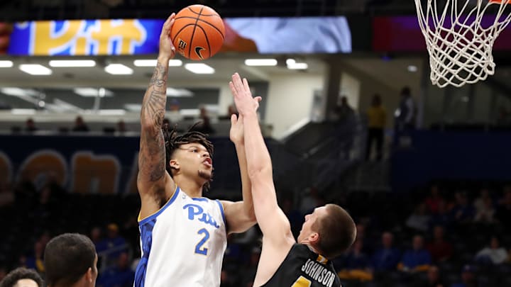 Nov 18, 2024; Pittsburgh, Pennsylvania, USA; Pittsburgh Panthers forward Cameron Corhen (2) shoots against Virginia Military Keydets forward TJ Johnson (44) during the first half at the Petersen Events Center. Mandatory Credit: Charles LeClaire-Imagn Images Nov 18, 2024; Pittsburgh, Pennsylvania, USA; Pittsburgh Panthers forward Cameron Corhen (2) shoots against Virginia Military Keydets forward TJ Johnson (44) during the first half at the Petersen Events Center. Mandatory Credit: Charles LeClaire-Imagn Images