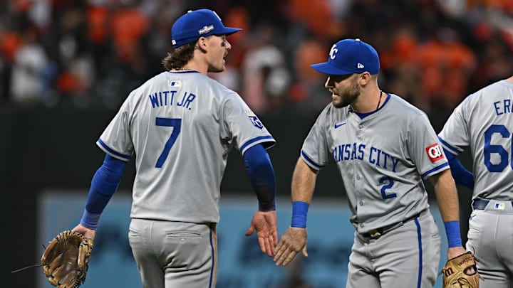 Oct 1, 2024; Baltimore, Maryland, USA; Kansas City Royals shortstop Bobby Witt Jr. (7) and Kansas City Royals outfielder Garrett Hampson (2) celebrate after defeating the Baltimore Orioles in game one of the Wild Card round for the 2024 MLB Playoffs at Oriole Park at Camden Yards. Mandatory Credit: Tommy Gilligan-Imagn Images