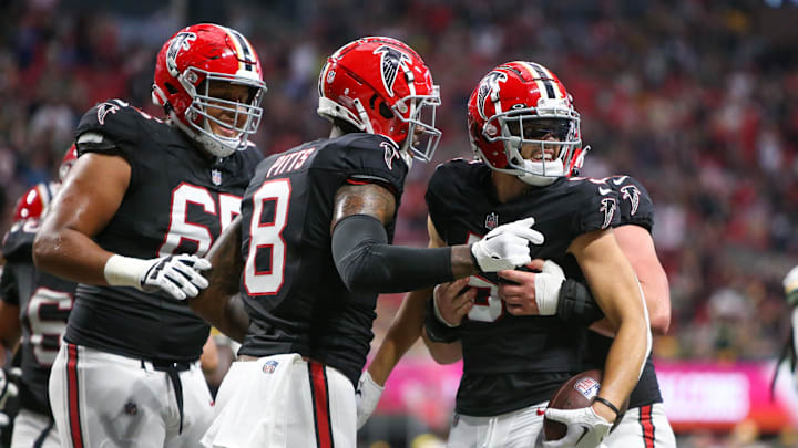 Atlanta Falcons tight end Kyle Pitts celebrates after a catch by wide receiver Drake London.