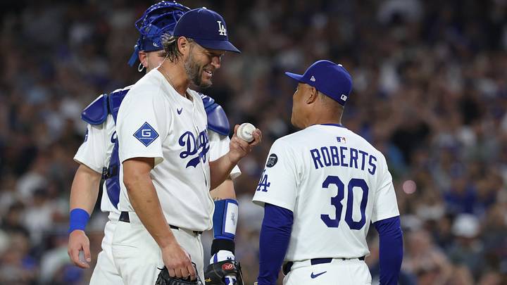 Sep 19, 2025; Los Angeles, California, USA; Los Angeles Dodgers pitcher Clayton Kershaw (22) greets manager Dave Roberts (30) as he is relieved during the fifth inning against the San Francisco Giants at Dodger Stadium. Mandatory Credit: Kiyoshi Mio-Imagn Images