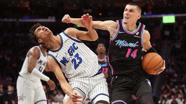 Mar 14, 2026; Miami, Florida, USA; Miami Heat guard Tyler Herro (14) fouls Orlando Magic forward Tristan da Silva (23) during the second half at Kaseya Center. Mandatory Credit: Jim Rassol-Imagn Images Mar 14, 2026; Miami, Florida, USA; Miami Heat guard Tyler Herro (14) fouls Orlando Magic forward Tristan da Silva (23) during the second half at Kaseya Center. Mandatory Credit: Jim Rassol-Imagn Images
