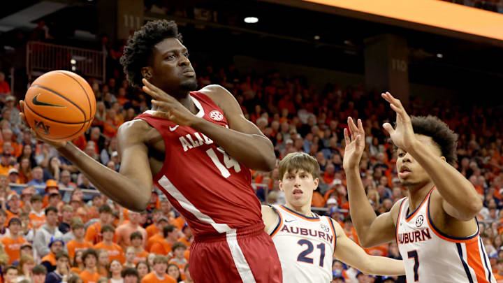 Feb 7, 2026; Auburn, Alabama, USA;  Alabama Crimson Tide center Charles Bediako (14) makes a pass during the first half against the Auburn Tigers at Neville Arena. Mandatory Credit: John Reed-Imagn Images