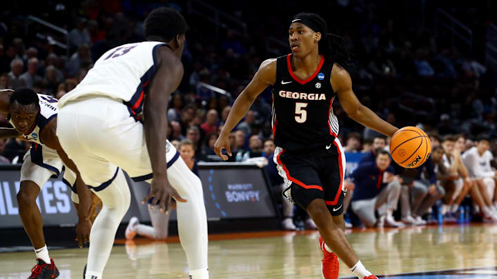 Mar 20, 2025; Wichita, KS, USA; Georgia Bulldogs guard Silas Demary Jr. (5) dribbles against Gonzaga Bulldogs forward Graham Ike (13) in the second half of a first round men’s NCAA Tournament game at Intrust Bank Arena. Mandatory Credit: Nick Tre. Smith-Imagn Images