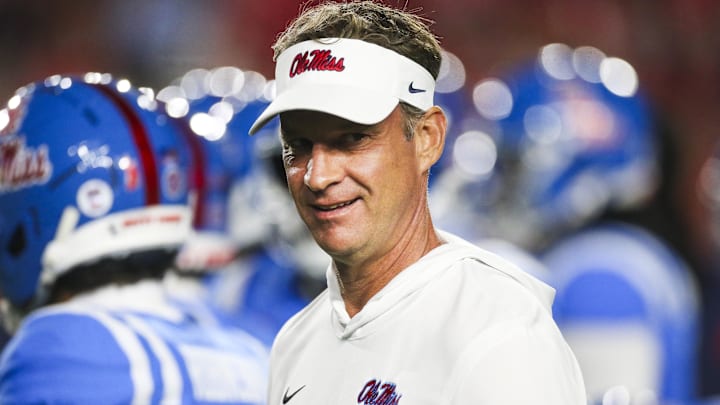 Nov 15, 2025; Oxford, Mississippi, USA; Mississippi Rebels head coach Lane Kiffin watches pregame warmups against the Florida Gators at Vaught-Hemingway Stadium.