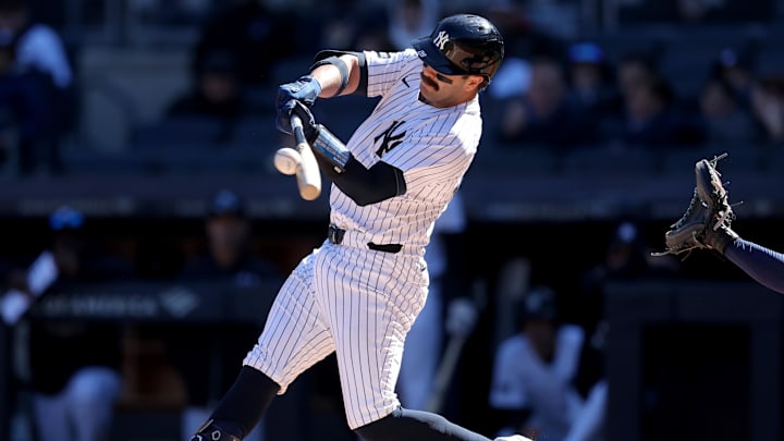 Mar 27, 2025; Bronx, New York, USA; New York Yankees catcher Austin Wells (28) hits a solo home run against the Milwaukee Brewers during the first inning at Yankee Stadium. 