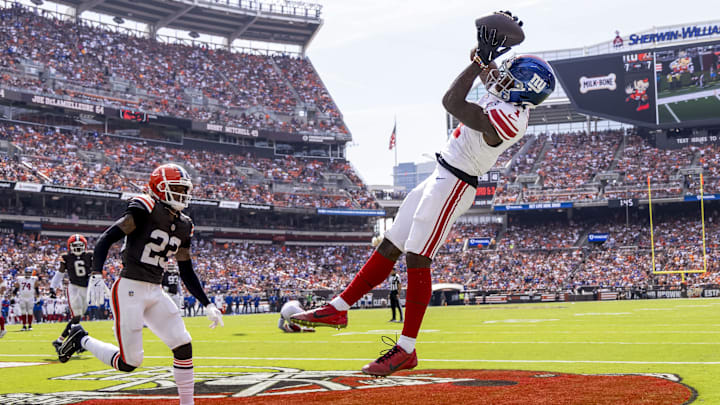 Sep 22, 2024; Cleveland, Ohio, USA; New York Giants wide receiver Malik Nabers (1) makes a touchdown reception under coverage by Cleveland Browns cornerback Martin Emerson Jr. (23) during the second quarter at Huntington Bank Field.  