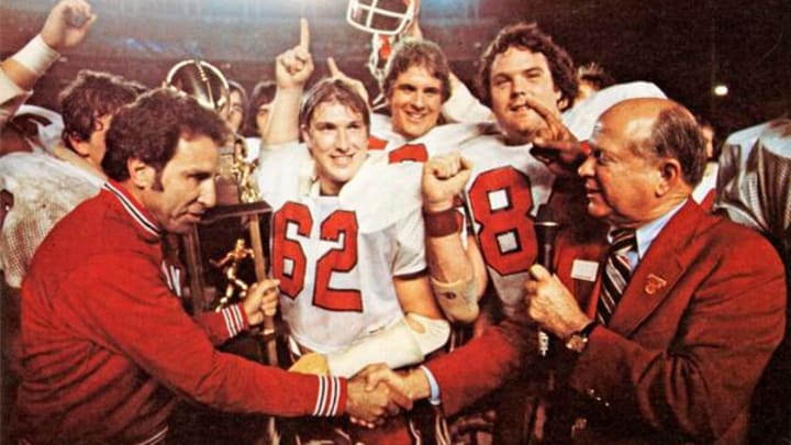 Indiana football coach Lee Corso (left), co-captain Terry Tallen (62) and tight end Bob Stephenson celebrate the Hoosiers' win over BYU in the 1979 Holiday Bowl.