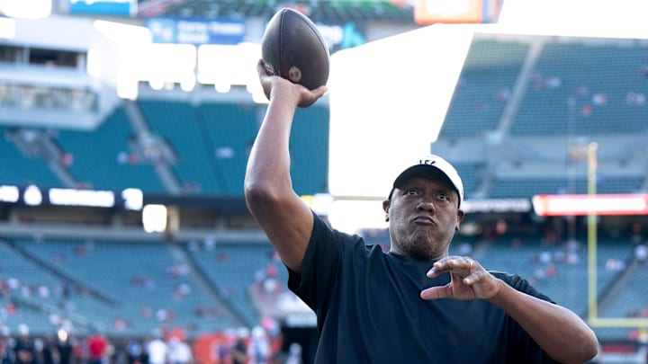 Cincinnati Bengals defensive line coach Marion Hobby throws a ball with fans before NFL preseason game between the Cincinnati Bengals and the Indianapolis Colts at Paycor Stadium in Cincinnati on Thursday, Aug. 22, 2024.