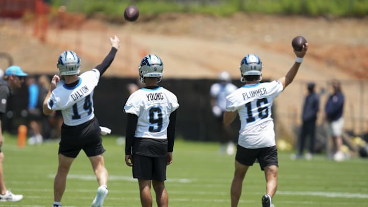 Jun 11, 2025; Charlotte, NC, USA; Carolina Panthers quarterback Bryce Young (9) waits his turn as quarterback Andy Dalton (14) and quarterback Jack Plummer (16) throw during minicamp at Bank of America Stadium. Mandatory Credit: Jim Dedmon-Imagn Images Jun 11, 2025; Charlotte, NC, USA; Carolina Panthers quarterback Bryce Young (9) waits his turn as quarterback Andy Dalton (14) and quarterback Jack Plummer (16) throw during minicamp at Bank of America Stadium. Mandatory Credit: Jim Dedmon-Imagn Images