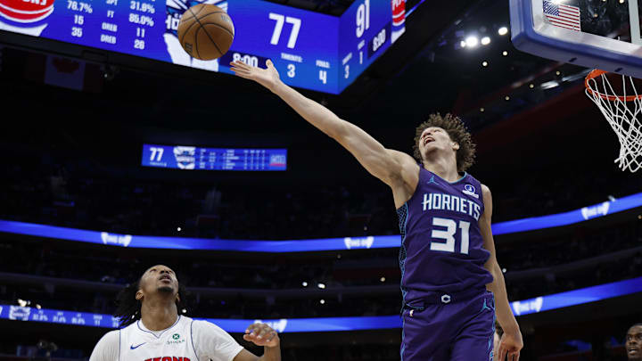 Dec 20, 2025; Detroit, Michigan, USA;  Charlotte Hornets forward Tidjane Salaun (31) goes for the rebound in the second half against the Detroit Pistons at Little Caesars Arena. Mandatory Credit: Rick Osentoski-Imagn Images